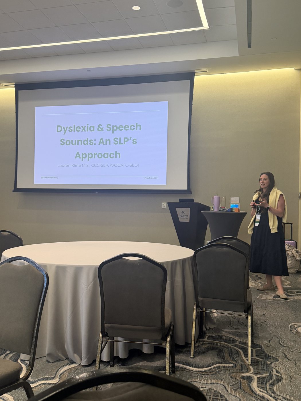 Lauren Kline presenting 'Dyslexia & Speech Sounds: An SLP's Approach' to an audience